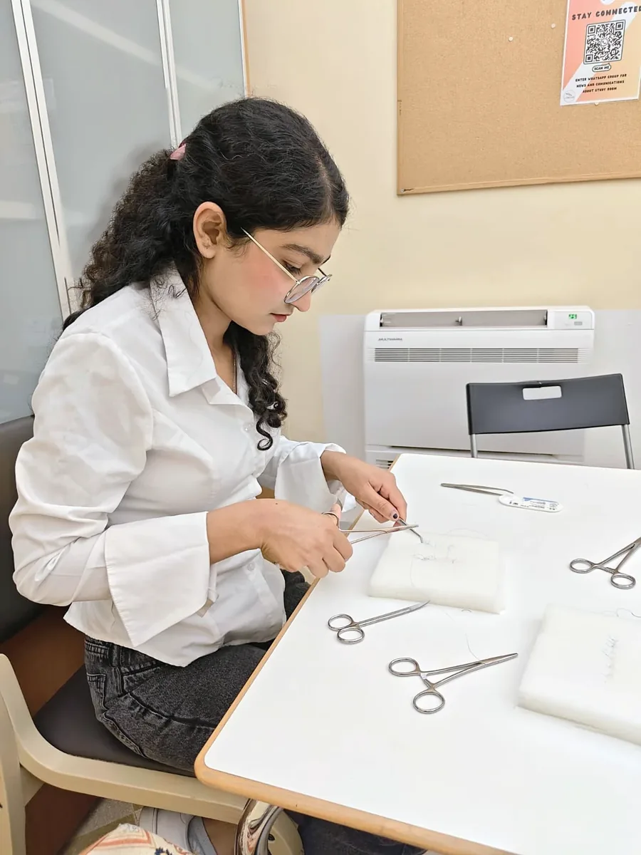 Ankita Roy practising sutures in a skills lab